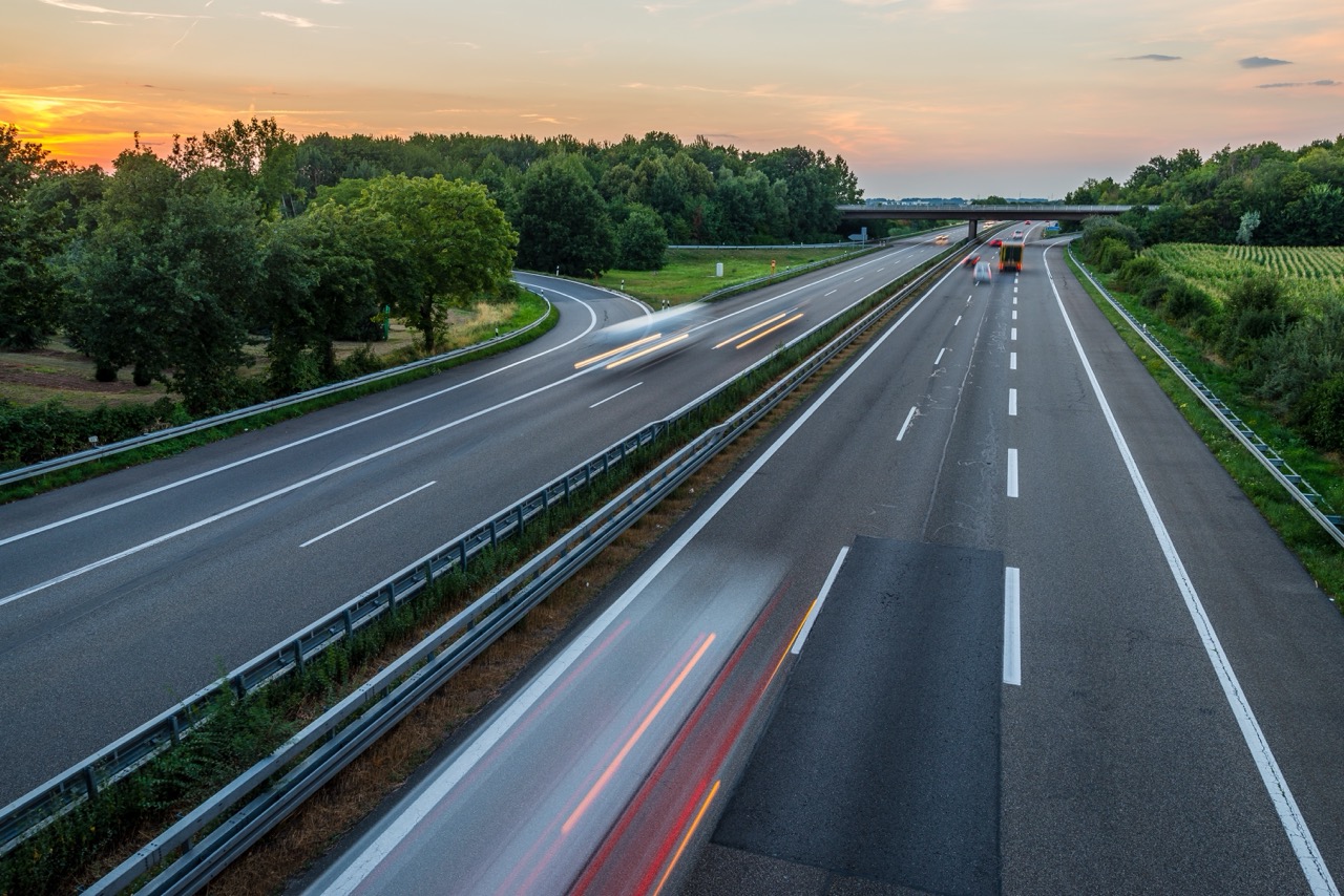 Timelapse shot of cars driving on the highway at sunset, representing HighWay Marketing Co.'s focus on guiding clients down the right path.